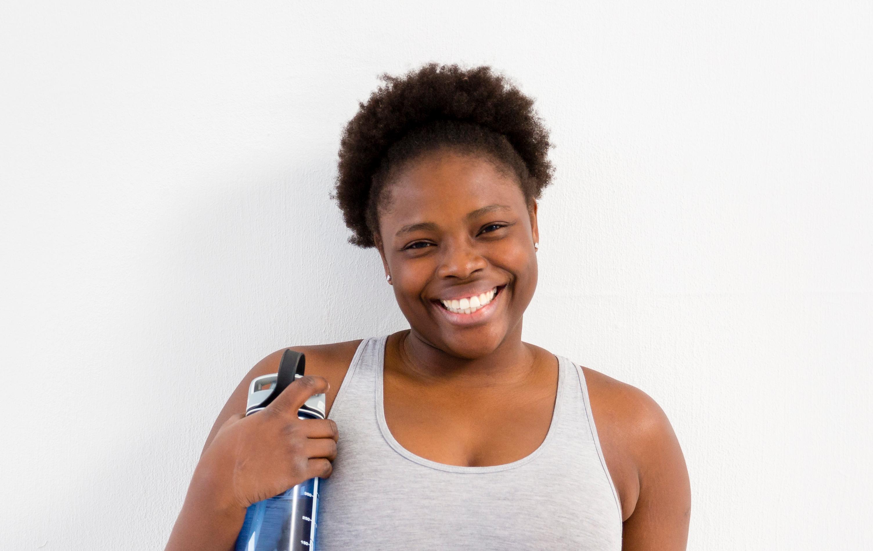 smiley woman in gym attire